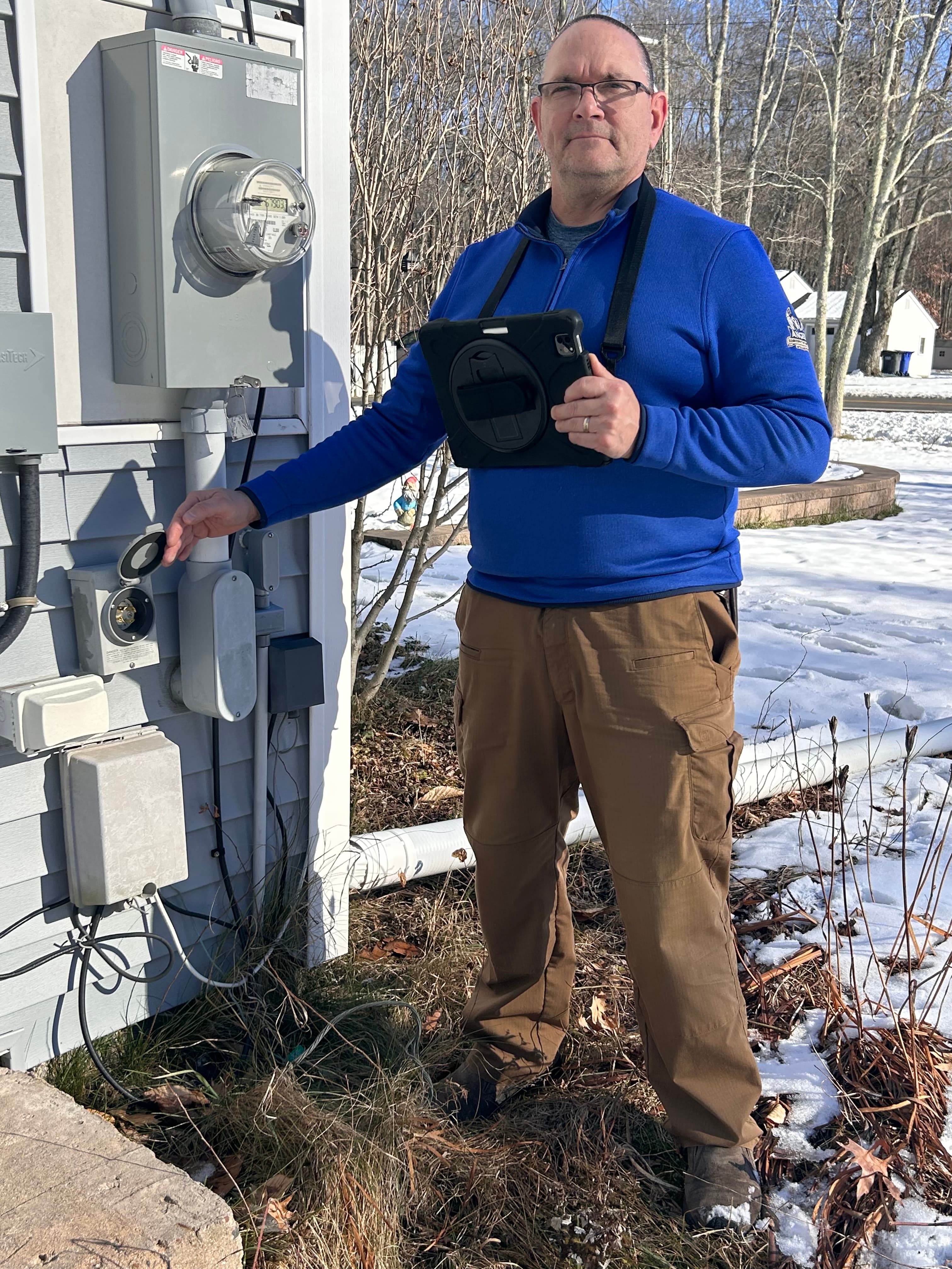 Jim Angell inspecting HVAC system
