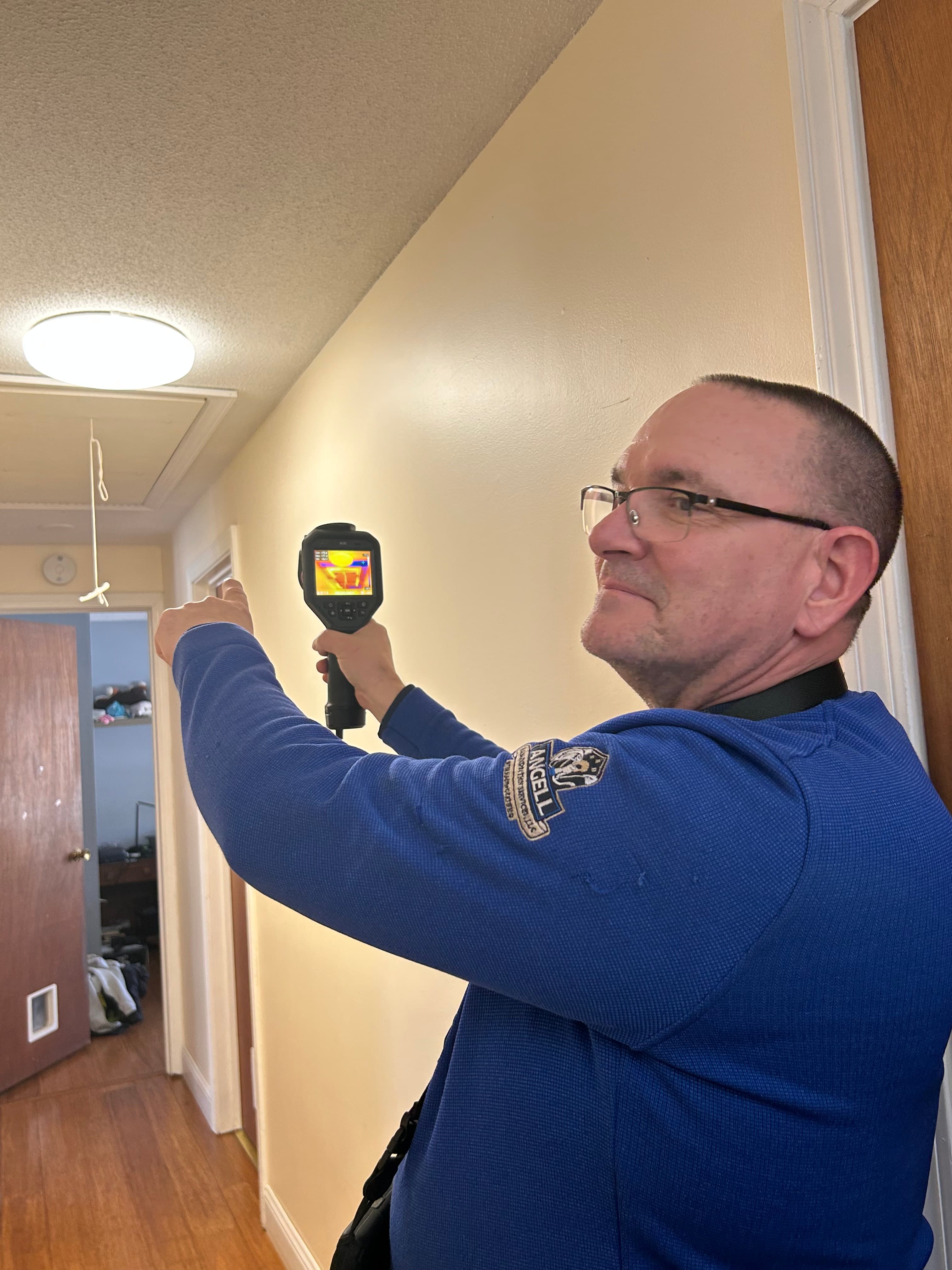 Jim Angell using thermal imaging camera